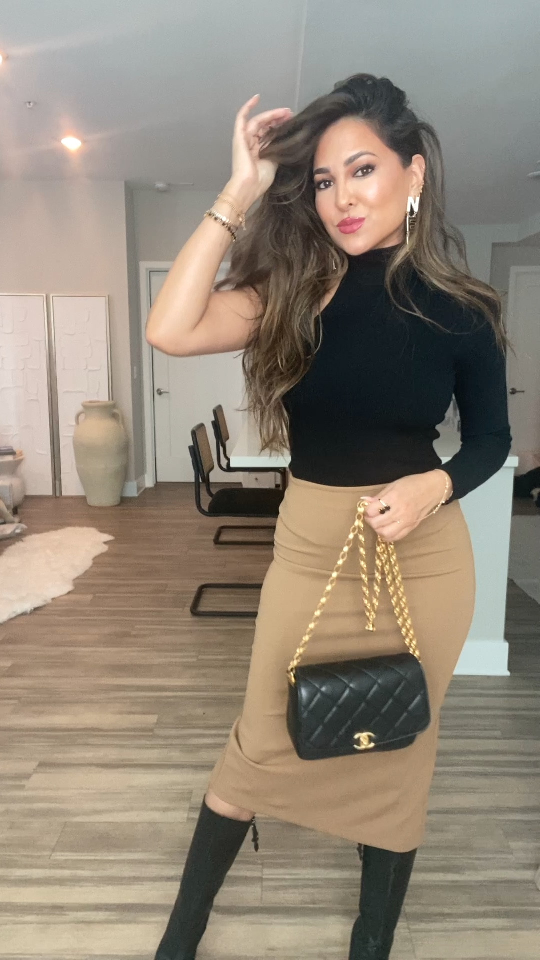 GRWM: Styling A Midi Skirt Pt. III

I’ve always been obsessed with midi skirts, especially faux leather ones for Fall!  They’re the perfect amount of class, style, and sexiness. 

Outfit Breakdown:
skirt — @zara “midi skirt with slit” ref# 7901/634
(just got the skirt in but it went on sale and sold out)
boots — @lacademie_ x @revolve 
bag + earrings — @chanelofficial 
highlighter — @rarebeauty 
perfume — @muglerofficial 
ring + bracelet — @juliavaughn

#LTKstyletip #LTKunder50 #LTKbeauty