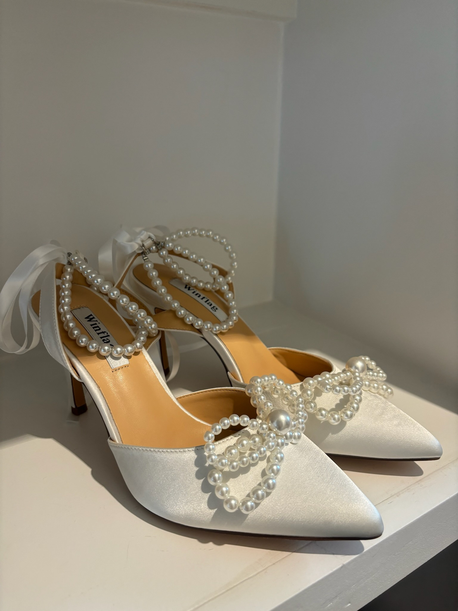 Pearl wedding shoes! 

Bride, high heels, bow, closed toe, pointed toe, stiletto, bridal