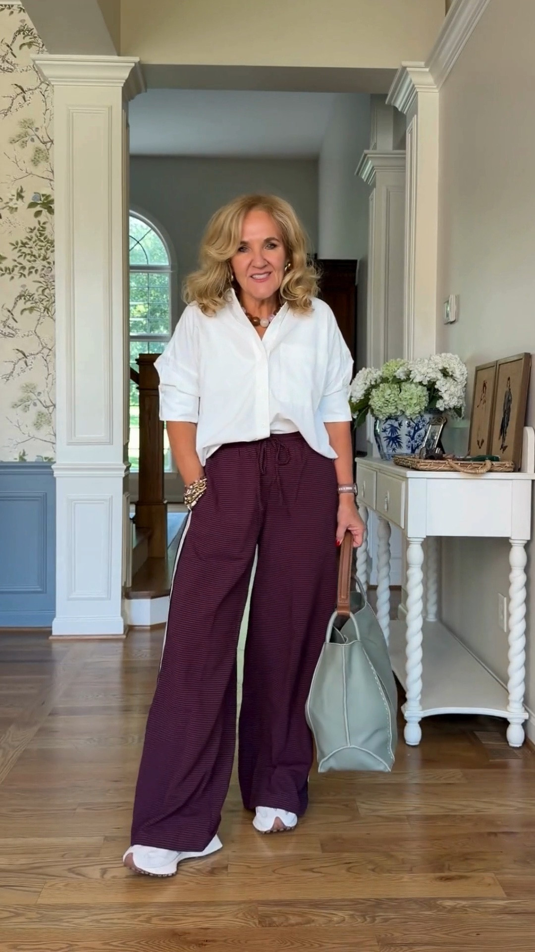 Tap the bell 🔔, heart ❤️ this post, and save for later!

A crisp white button-down and relaxed burgundy wide-leg pants make an easy, polished everyday outfit. I love the comfortable proportions with sneakers for errands, travel days, or casual lunches.

Fit note: Medium in the pants, small in the blouse

#LTKootd #LTKTravel #LTKOver40