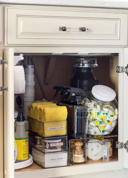 My under the kitchen sink cabinet is kept organized with risers, turntables and stackable bins, all labeled with the contents, to keep all of my cleaning supplies accessible. home storage kitchen storage cabinet storage home organization kitchen organization cabinet organization cleaning supply organ corner cabinet organization 

#LTKunder50 #LTKhome #LTKstyletip