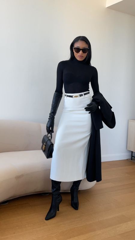 A white maxi skirt and black turtleneck look