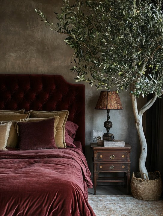 Rustic glamour meets European Mediterranean elegance in this bold bedroom refresh for 2026. A plush burgundy velvet bed instantly sets the tone, adding richness and depth, while layered taupe and burgundy bedding softens the look and keeps it inviting rather than heavy. The oversized olive tree brings in organic movement and balance, grounding the space and adding that unmistakable Old World, designer feel.

This bedroom proves that going bold doesn’t mean going loud. Deep colors, tactile fabrics, and natural elements work together to create a space that feels luxurious, calm, and intentionally curated. If your bedroom feels tired or too neutral, this is your sign to embrace color, texture, and statement pieces for a truly elevated bedroom refresh.

#BedroomRefresh2026
#RusticGlamourBedroom
#EuropeanMediterraneanStyle
#BurgundyBedroom
#VelvetBedStyle
#OliveTreeDecor
#DesignerBedroom
#BoldInteriors 

 #LTKHome