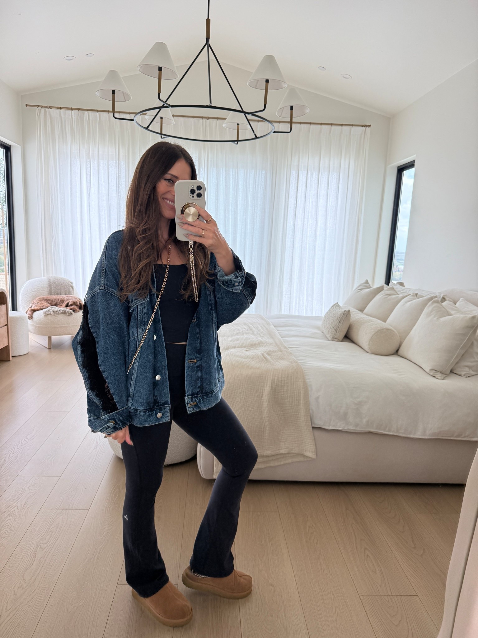 Anthropologie oversized jean jacket with black lace and alo flared leggings paired with a go to Amazon purse 

#LTKootd #LTKgrwm