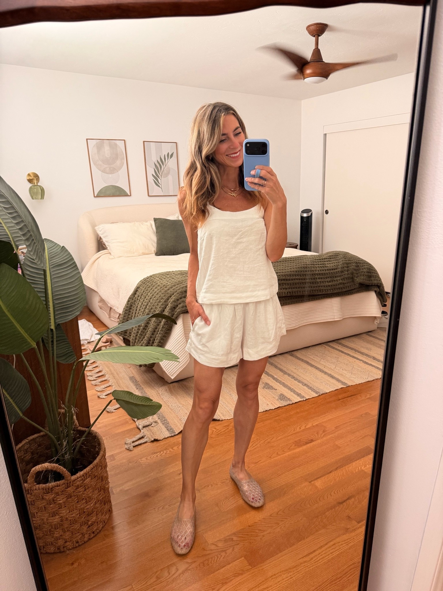 The kind of outfit I want to live in all summer. 🤍 So simple, lightweight and easy, but still feels put together. This would be such a good travel outfit, vacation staple, or just an everyday summer look with sandals. Wearing a small in the shorts, & i love how they feel oversized. Shorts & top are on SALE! Wearing XS in top & small in shorts 

white matching set, white shorts set, two piece set, linen look set, summer matching set, neutral outfit, summer outfit, vacation outfit, resort wear, travel outfit, casual summer style, mom style, everyday outfit, summer basics, white summer outfit, jelly shoes

#LTKootd #LTKOver40 #LTKTravel