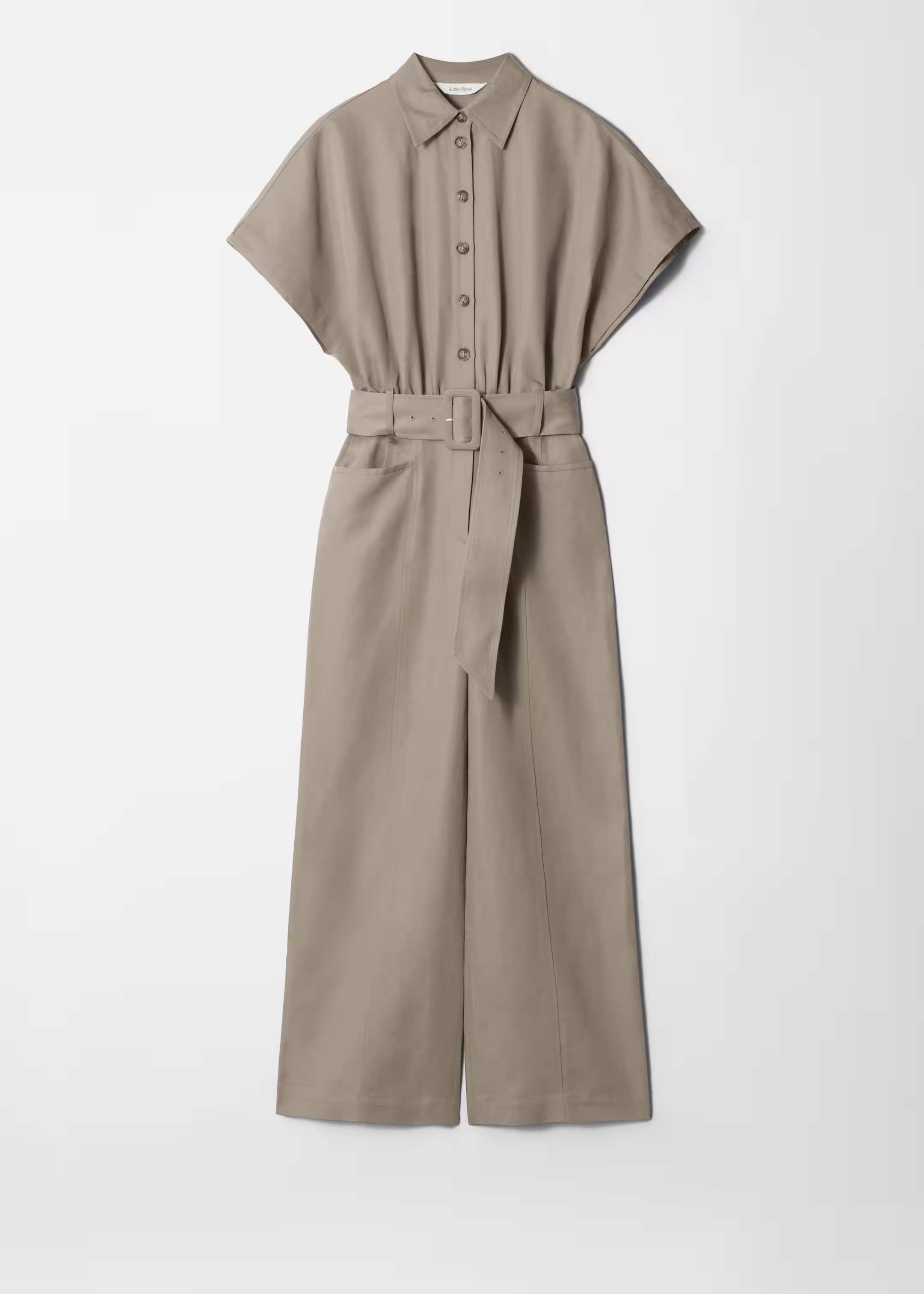 Relaxed 70’s inspired jumpsuit crafted from a lightweight cotton and linen blend. Featuring sho... | & Other Stories - US