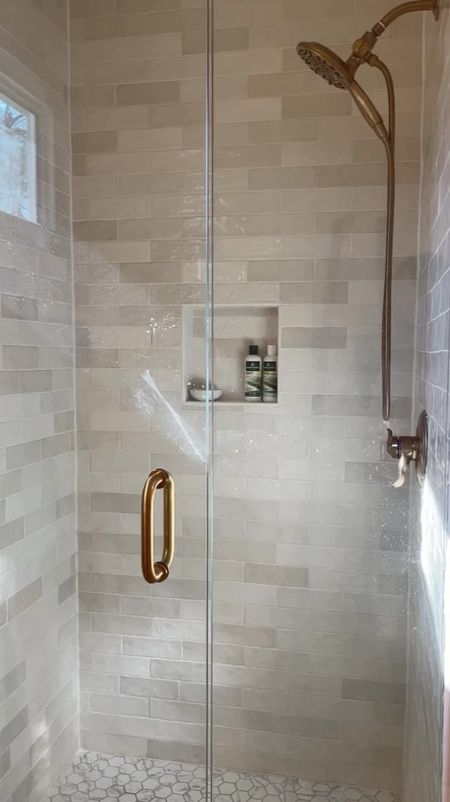 Our shower looks expensive but the tile and door are from Home Depot.  

Kingston Brass shower fixtures.  Home depot Ivy Hill artisan subway tile.  Champagne Bronze shower head.  Ceramic mosaic porcelain floor tile.  

#LTKHome #LTKStyleTip #LTKFamily