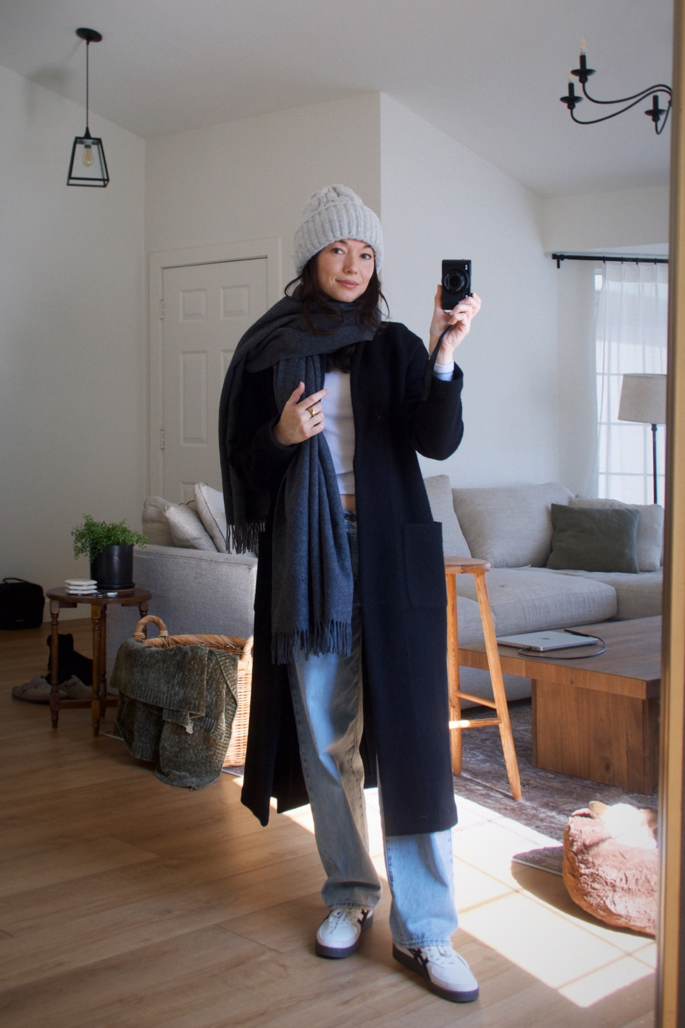 Casual winter outfit ❄️ Cozy layers for chilly days! Wearing a long black coat, oversized scarf, knit beanie, relaxed denim, and sneakers! #WinterOutfit #CasualStyle #CozyFashion 

#LTKShoeCrush #LTKSeasonal #LTKFindsUnder50