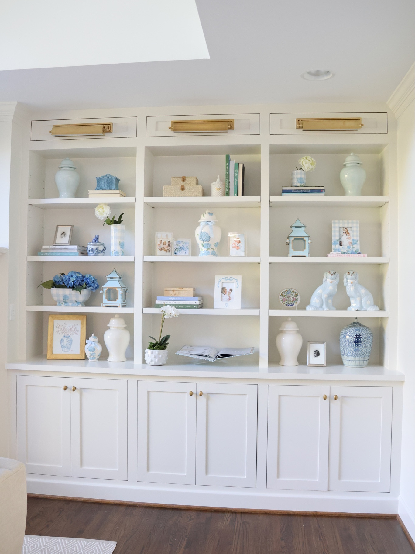 Bookshelf decor! Shop my living room decor here! 

Love these light blue staffordshire dogs! All of the ceramics are from my LoHome collection!

#LTKGiftGuide #LTKfindsunder100 #LTKhome