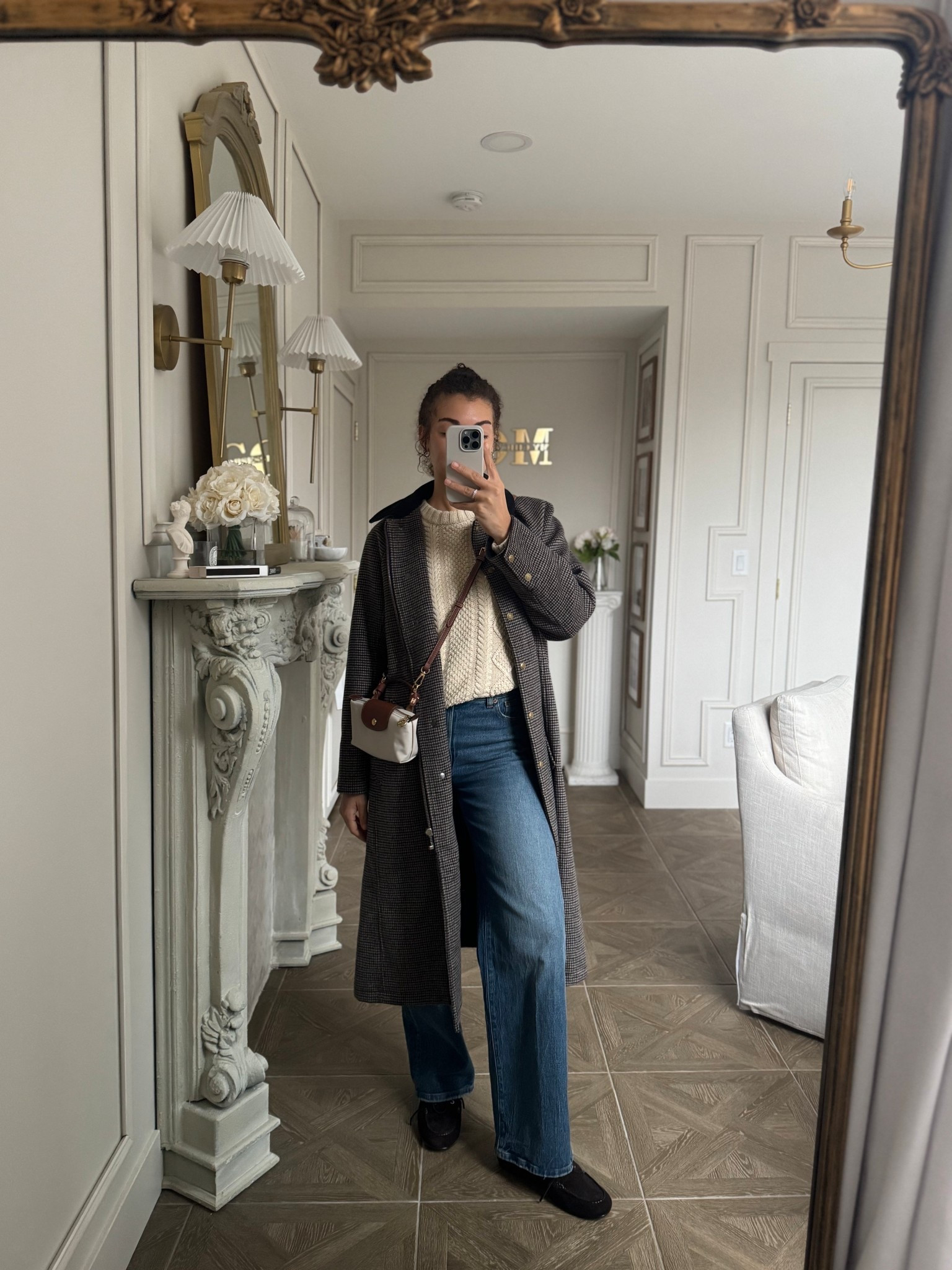 Casual winter outfit with jeans, cable knit sweater, boat shoes, and a long barn jacket 

#LTKootd