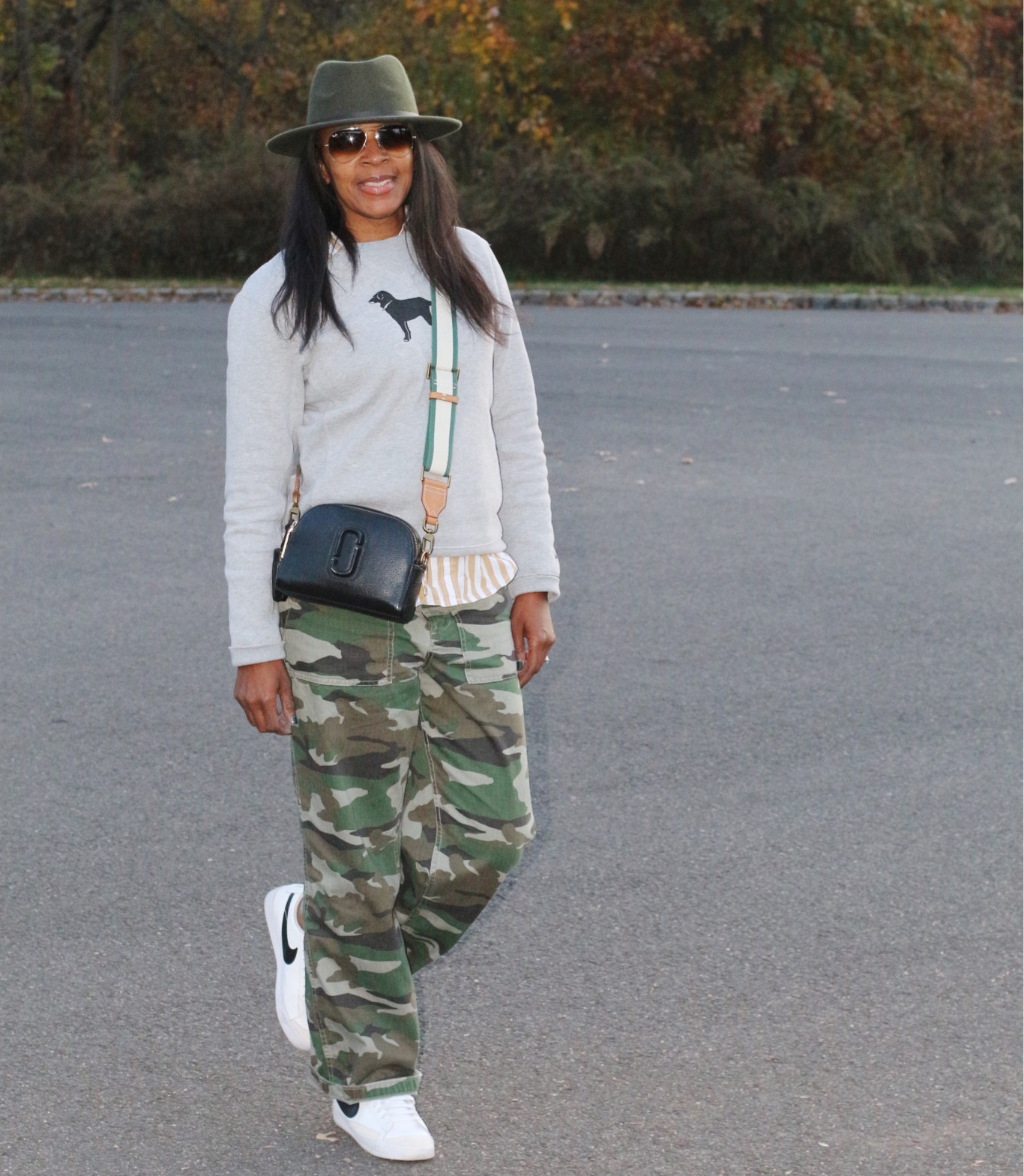 Casual weekend outfit army fatigue pants sweatshirt striped shirt Nike sneakers Marc Jacob crossbody fedora rayban shades 

#LTKunder100 #LTKSeasonal #LTKstyletip