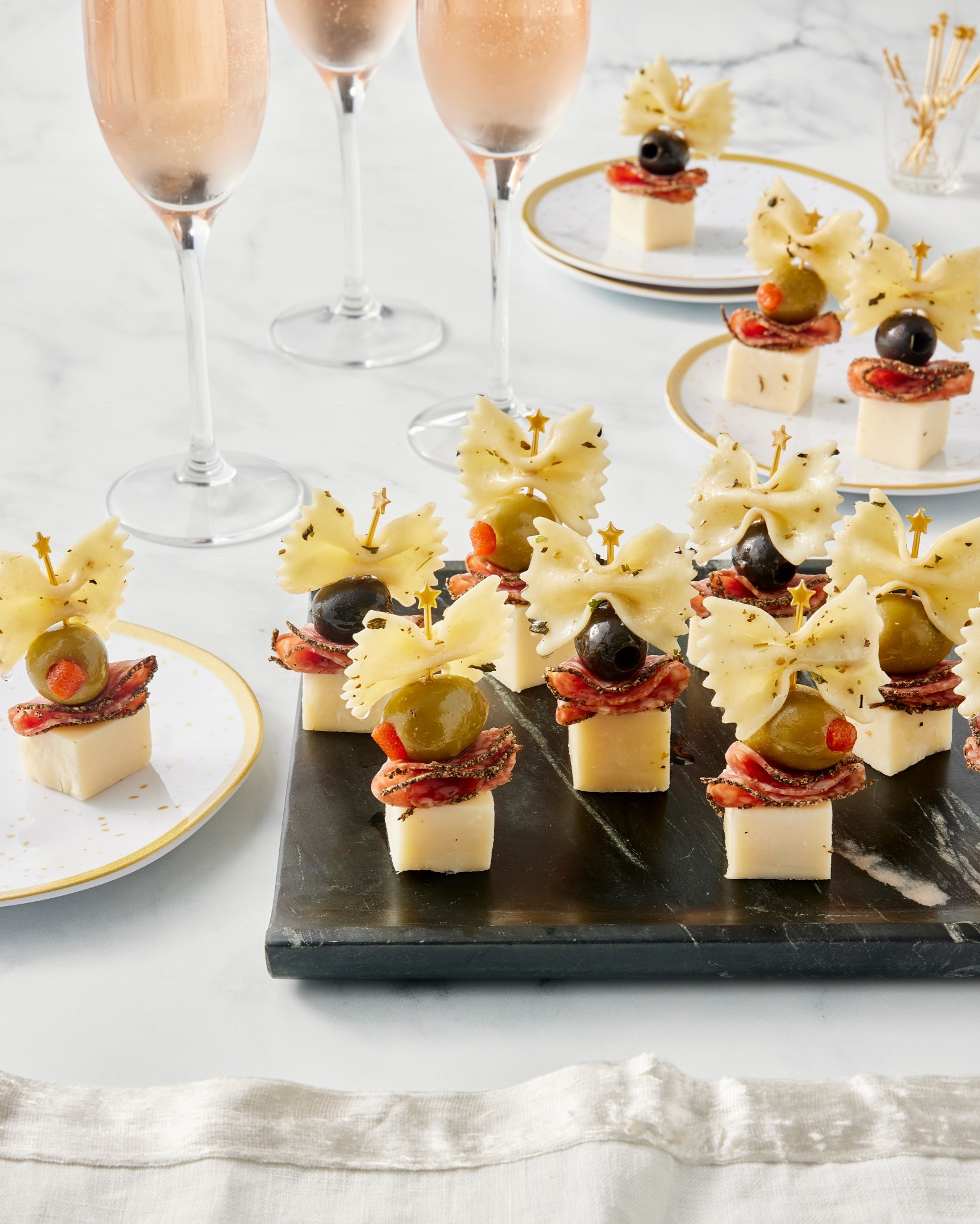 Bow-Tie Antipasto Bites are dressed to impress for the holidays or any special occasion! 🤩🫒🧀 Originally from my Brilliant Bites cookbook, they're easy, delicious and just so darn cute! There's a reason this charcuterie appetizer is a popular favorite 🤭

#LTKParties #LTKfoodie #LTKHoliday