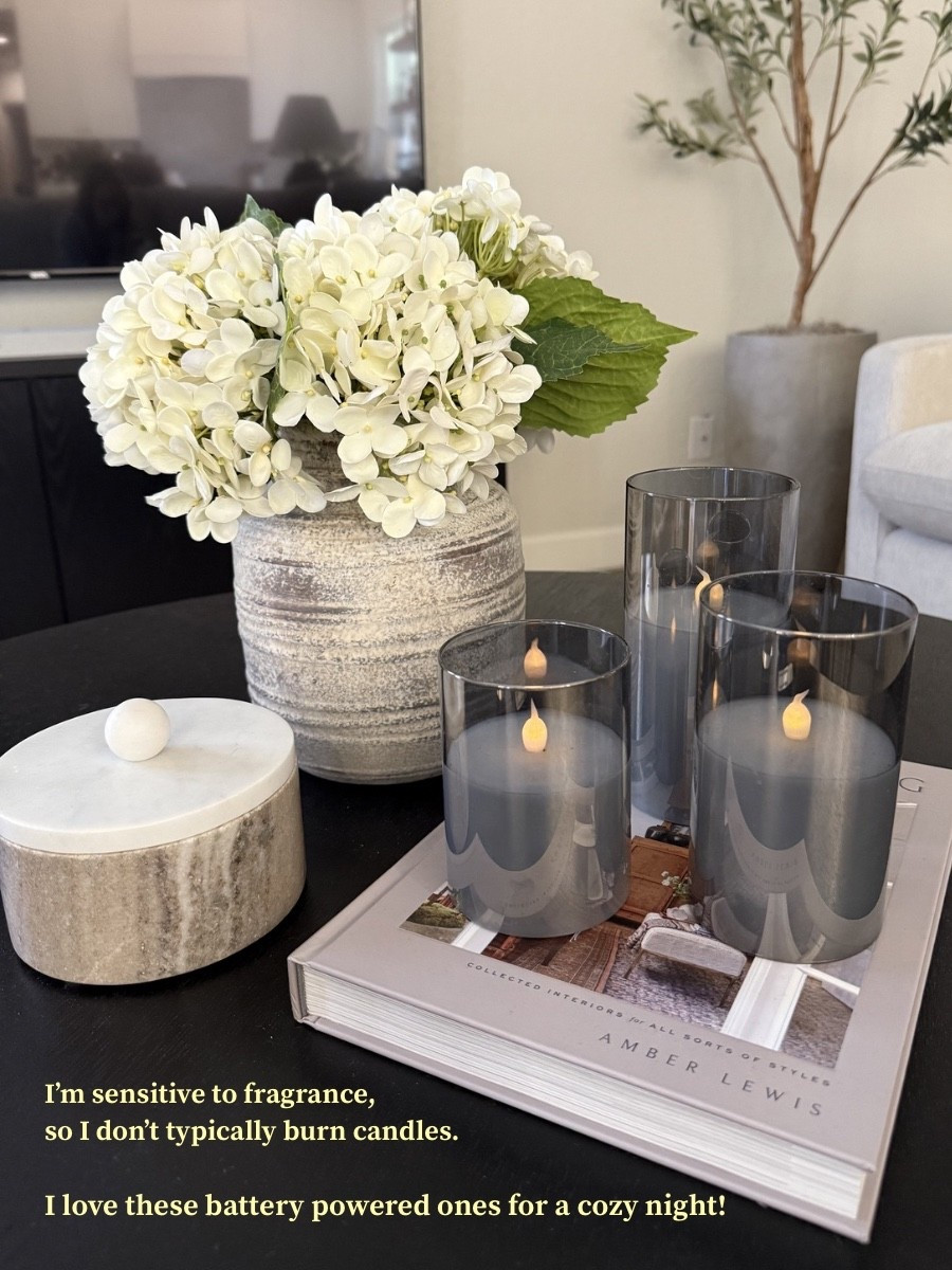 Flameless candles make a home so cozy! I am sensitive to fragrance, so I love these battery powered candles to get the same cozy ambiance without the toxins. They flicker too! 
•
•
Battery candle, faux candles, flameless candles, flameless 3 wick candle, coffee table decor, candle set, nontoxic home, nontoxic living, lowtox home, lowtox living 

#LTKSpringSale #LTKHome #LTKselfcare