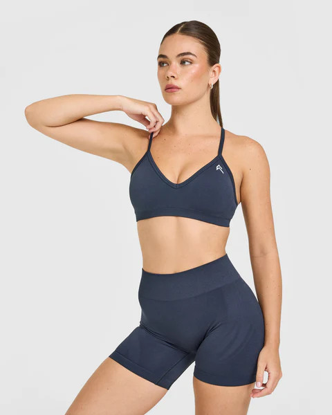 EnhanceLift™ Seamless Strappy Sports Bra with White Logo 
 True Blue | Oner Active (UK / US)