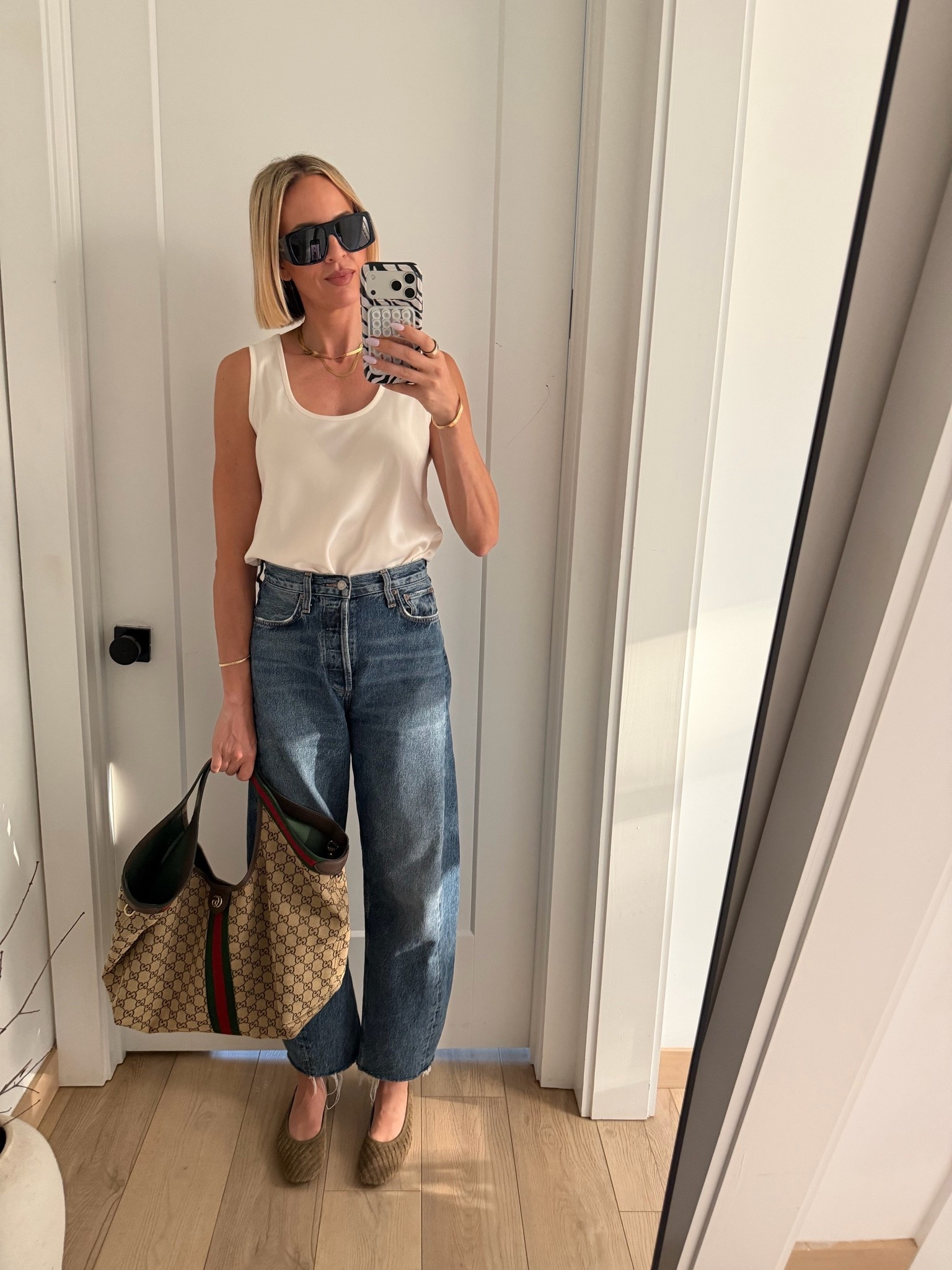 Wearing a small in the satin tank, size down one size and the jeans. Shoes run a bit small, but they stretch. Maybe size up a half a size ￼

#LTKWorkwear #LTKTall #LTKOver40