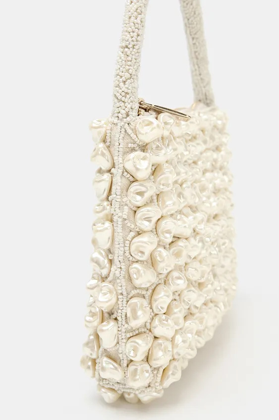 Handbag with beaded exterior and appliqu\u00e9s. Top handle. Interior pocket. Fastens with a meta... | Zara UK