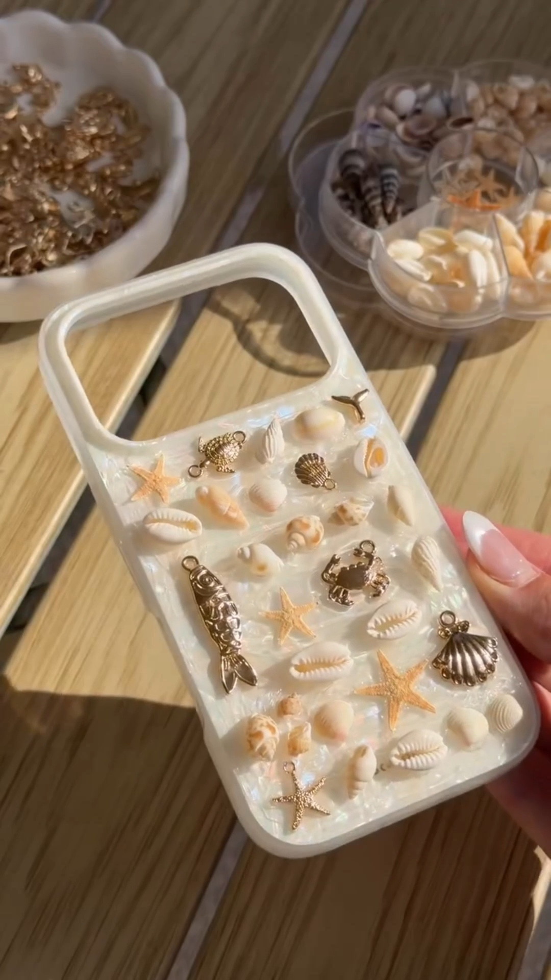 Obsessed with this DIY seashell phone case! 🐚 This was supposed to be a “collect seashells on vacation” and make it moment… but when that didn’t happen, Amazon came through! 🤍 

Such a fun summer craft idea for a get-together with the girls or just a peaceful moment at home. Send this idea to some other mermaids & comment ✨SHELL✨ for the links to everything I used. 

#girlsnightideas #summerhosting #beachyaesthetic #diycraftideas #amazonfinds