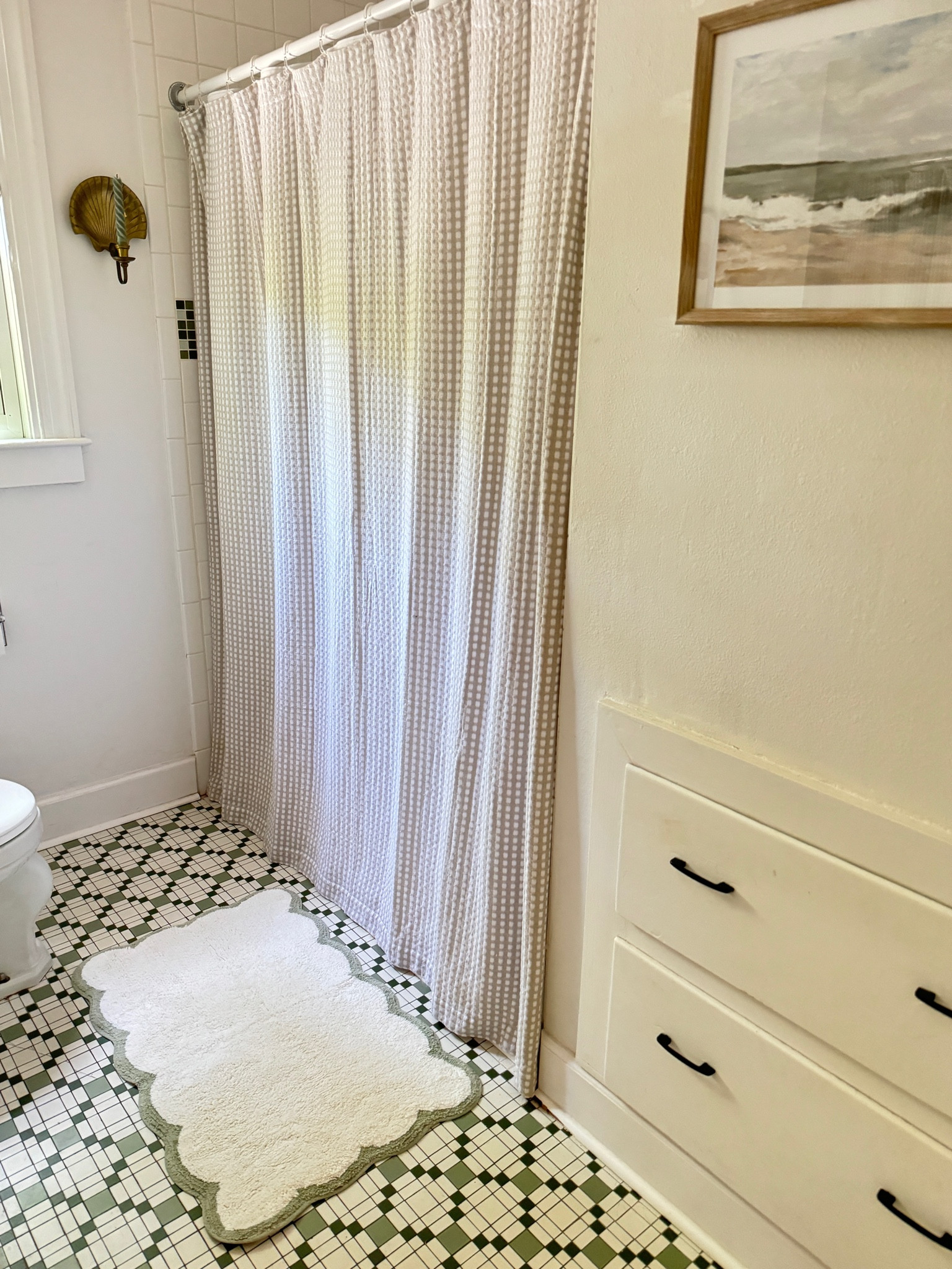 Scalloped green and white bath mat on sale!

#LTKfindsunder50 #LTKhome #LTKsalealert