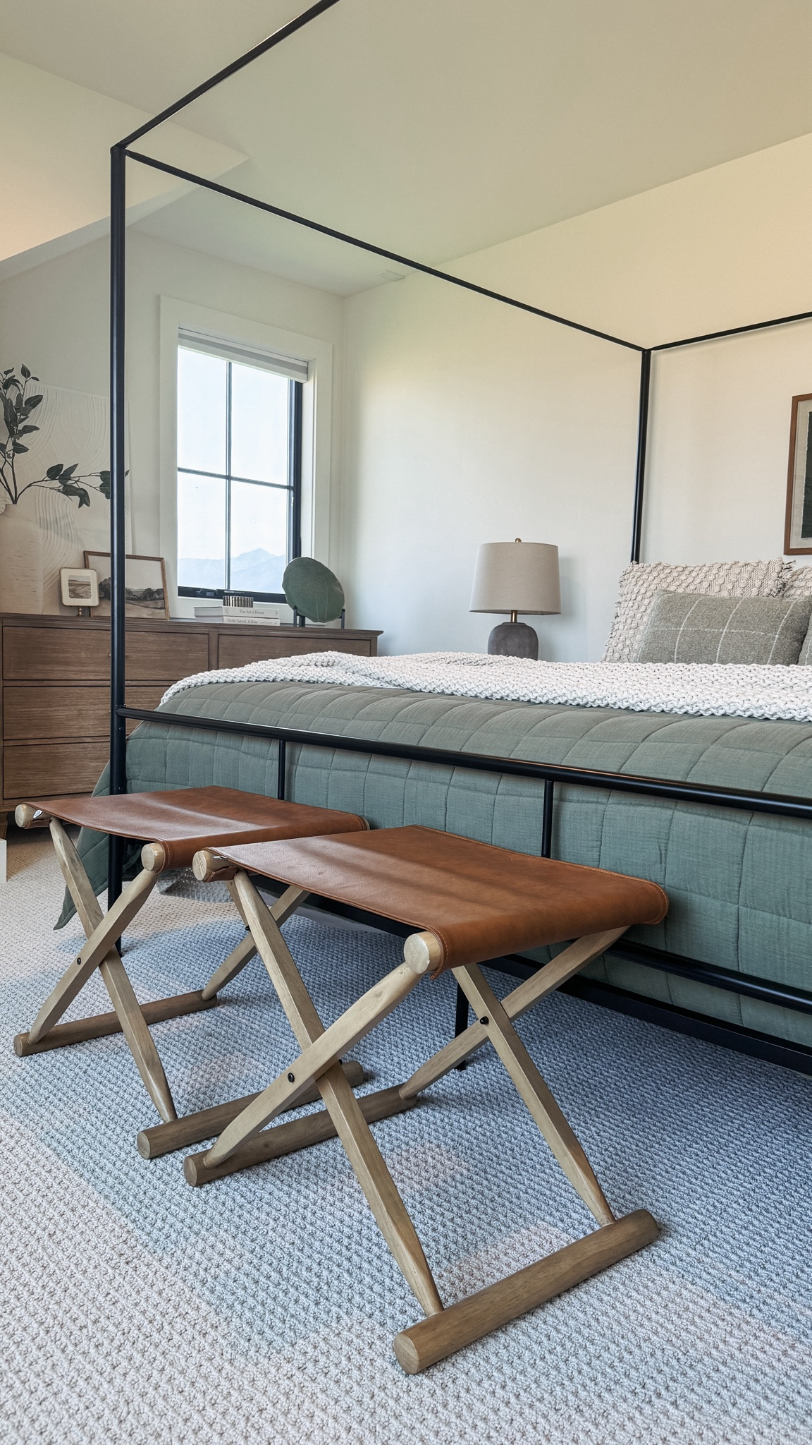 Folding leather accent stools at the end of our guest bed!

#LTKHome