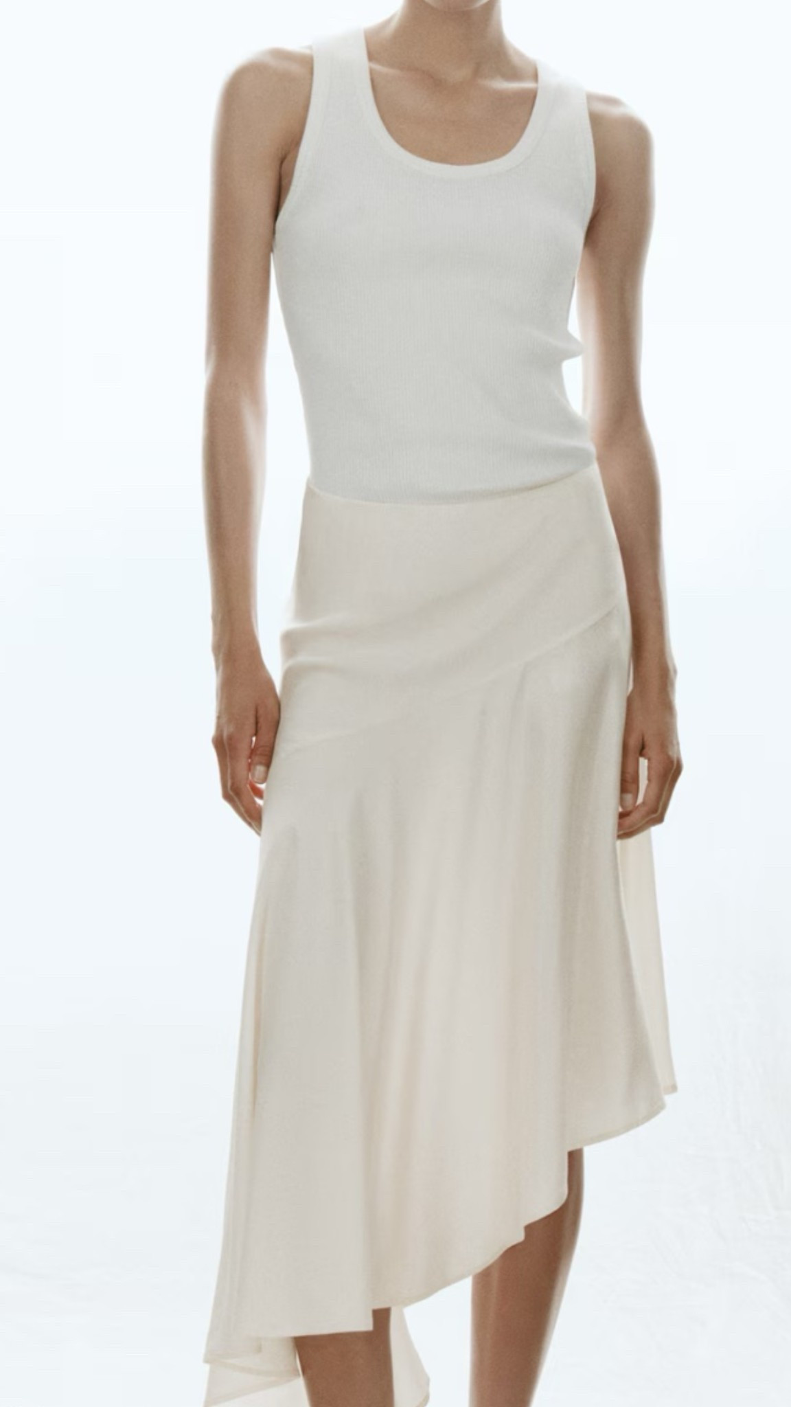 This asymmetrical skirt is perfect with a tank and sandals for vacation or summer

#LTKootd #LTKSeasonal #LTKOver40