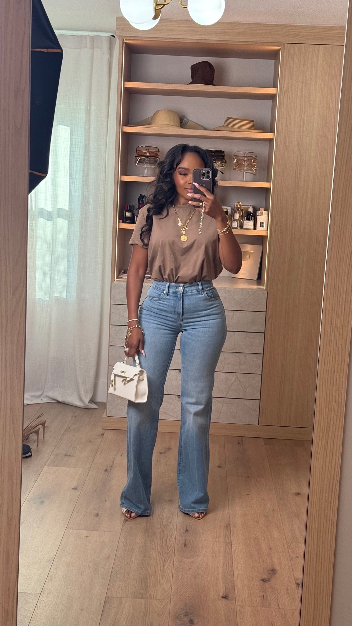 Hi babes! 🤎

Okay this neutral tee + perfect denim combo is EXACTLY the kind of outfit that always performs because it’s effortless, flattering, and insanely wearable. The warm mocha tone paired with this dark wash flare denim gives that elevated everyday vibe without trying too hard.

A good fitted tee and great jeans will forever be one of the smartest wardrobe investments because you can style them a million different ways. Added layered gold jewelry + a structured mini bag to give it that luxury-inspired feel while still keeping the look casual and easy.

Where to wear this:
• Coffee runs
• Casual office days
• Lunch dates
• Everyday errands
• Weekend shopping
• Casual dinner nights

This is one of those outfits where the cost per wear drops FAST because every piece works with so many staples already in your closet. Simple outfits styled well always look the most expensive.

Everything is linked below ✨

xx Kira | IG: KirasFashionFinds

5’4 | 140LBS | 34D-27-40 | size small | jeans 27

#LTKootd #LTKgrwm #LTKvlog