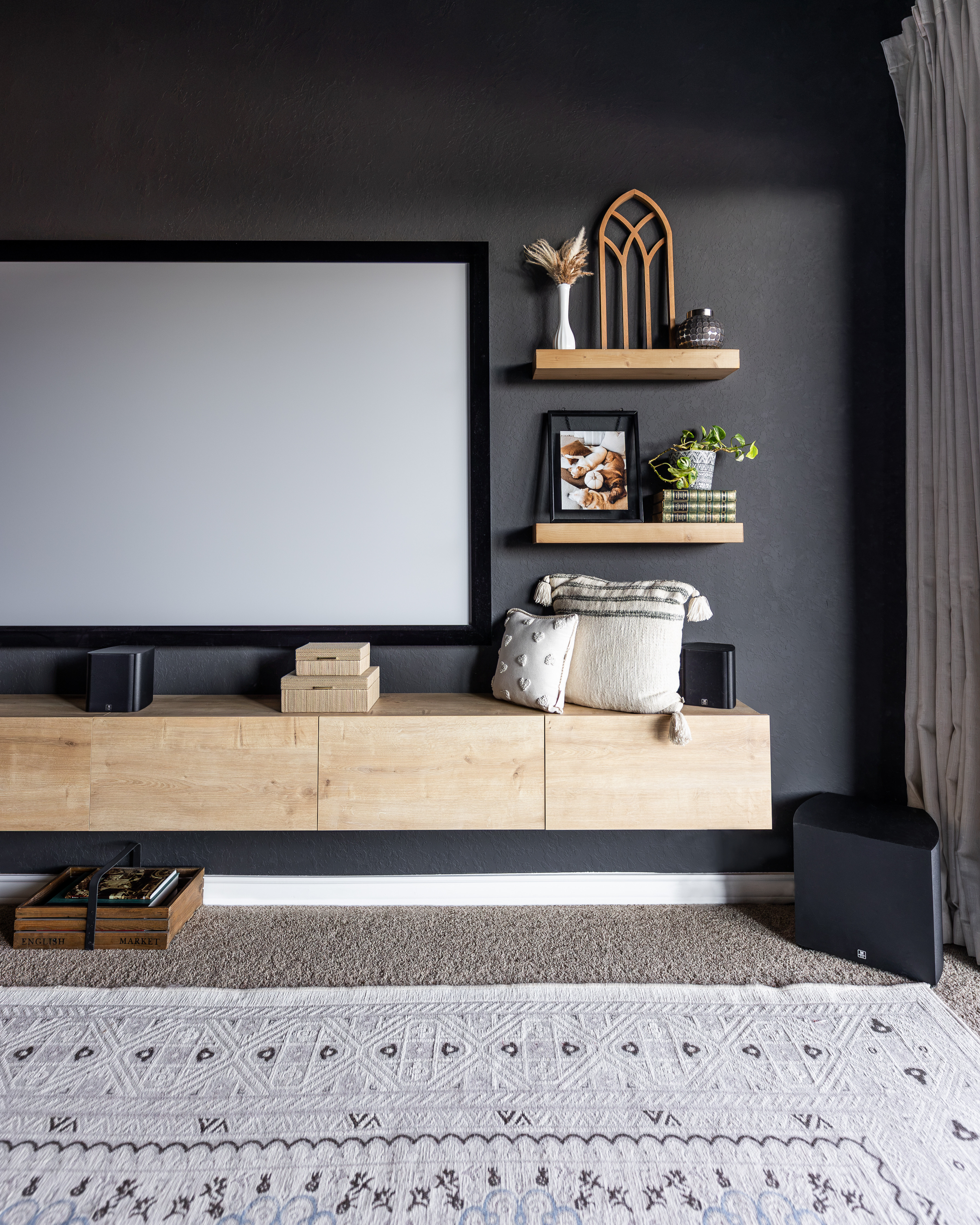This floating media cabinet completely transformed this space. The clean, wall-mounted design keeps the room feeling open, while the hidden storage makes it easy to tuck away gaming consoles, remotes, movies, board games, and all the little things that tend to collect in a media room.

Even better, it's currently over 50% OFF, making it a great time to grab it if you've been looking for a stylish storage solution that keeps everything looking neat and organized!

#LTKHome #LTKSaleAlert