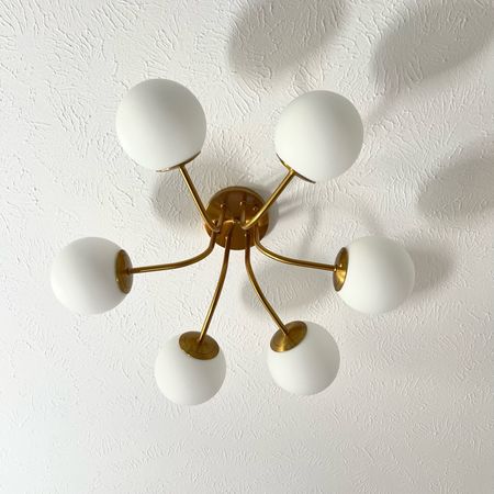 Budget 6 Globe light on Amazon. Gold semi-flush chandelier for a midcentury modern feel. #goldlights #semiflush #lightfixtures

#LTKhome