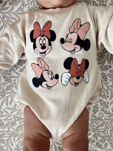 Baby Disney outfit. Love this oversized sweatshirt romper with Minnie Mouse and pink bows for a baby girl. Great for themed birthday parties or a trip to Disney! Fits true to size. Pair with tights or leggings for cold weather. 

#LTKbaby