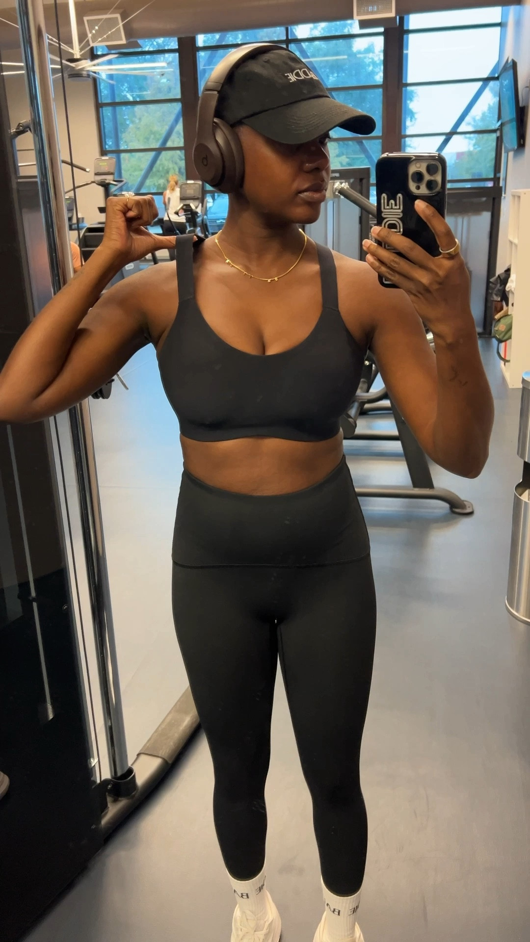 Winter gym outfit!! Black graphic dad hat, brown Beats by Dre, spanx sport bra and spanx leggings. I’m wearing a medium in all pieces. 

#LTKfitnessgoals #LTKFindsUnder100 #LTKmorningroutine