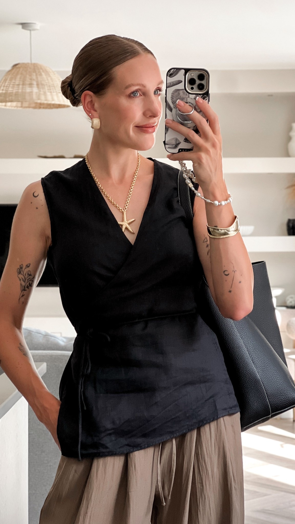 Arket linen wrap top 
Stradivarius wide leg trousers 
Sezane Starfish pendant Salvador necklace 
Marks and Spencers gold cuff 

Summer outfits for busy mum’s and the office - style for women over 30 

#LTKsummer #LTKuk