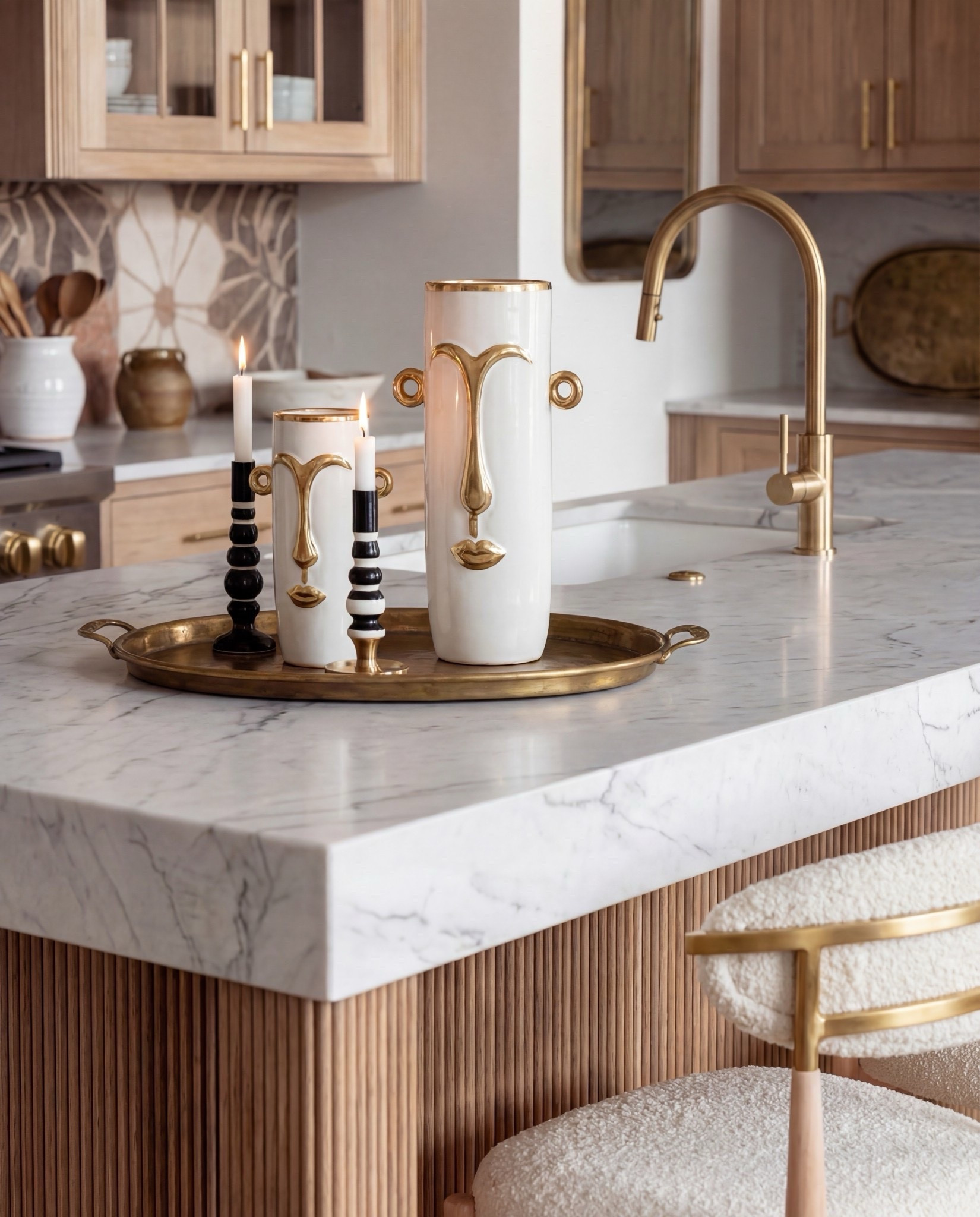 Shop the Look:
• Natural oak cabinetry (with fluted island detail)
• White + brass sculptural pendant lights
• White gas range with brass trim
• Warm floral tile backsplash
• Boucle + brass bar stools
• Marble countertops (soft veining)
• Brass kitchen hardware
• Ceramic vases + stone serveware
• Neutral vintage runner
• Gold tray + candle holders
• Oak beams (warm rustic contrast)

#LTKSaleAlert #LTKHome