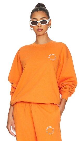 Monday Sweatshirt in Amber Glow | Revolve Clothing (Global)