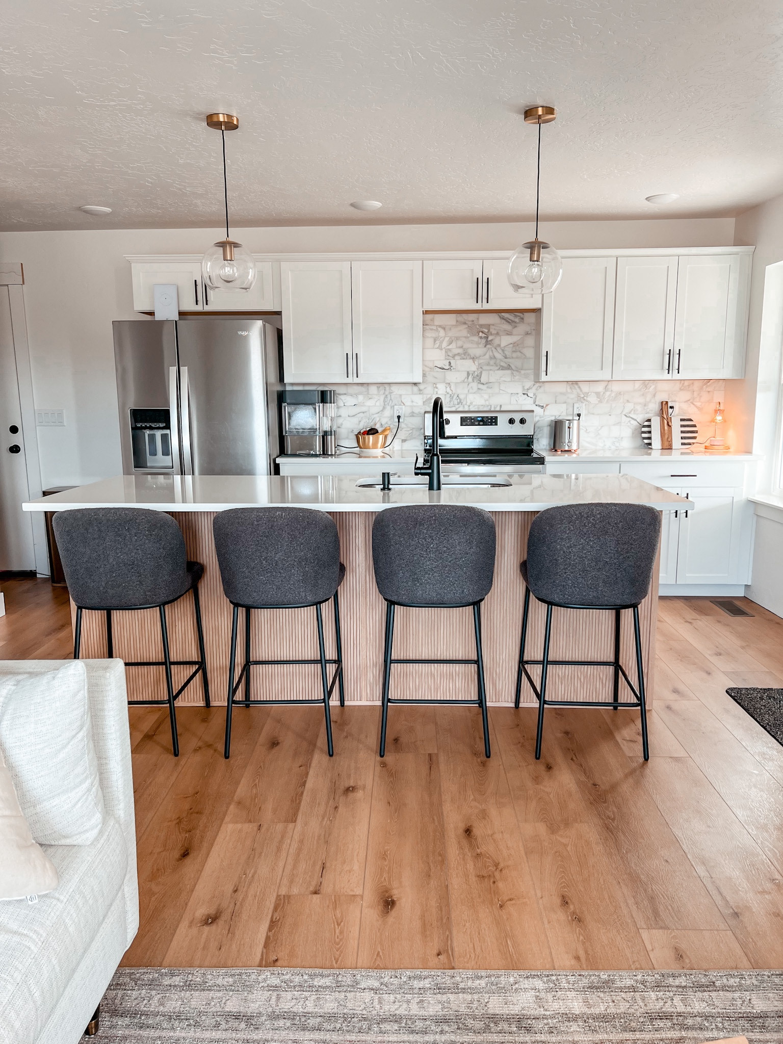 We are slowly adding in projects to our new ranch house! The most recent project was the pole wrap on our kitchen island. It broke up all the white, and helped give the kitchen a whole new look! Pole wrap, kitchen, barstools, ranch house. #polewrap #kitchen #diyprojects #barstools #diy 

#LTKhome #LTKstyletip #LTKunder100