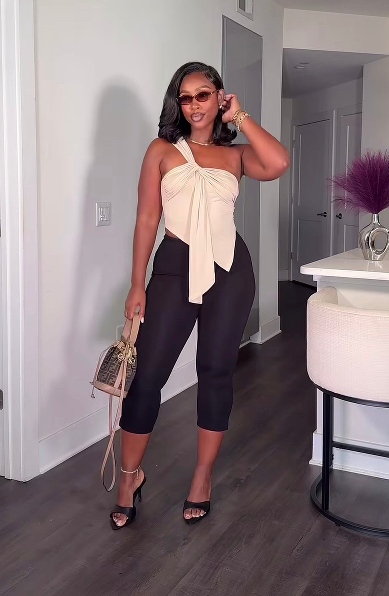 A little neutral, a little elevated, and all the way chic. 🤍✨

This asymmetrical tie-front top had me at hello, and these capri pants are officially making their comeback. Finished the look with black heels, gold accessories, and my favorite mini bag for an effortless summer moment.

#LTKootd