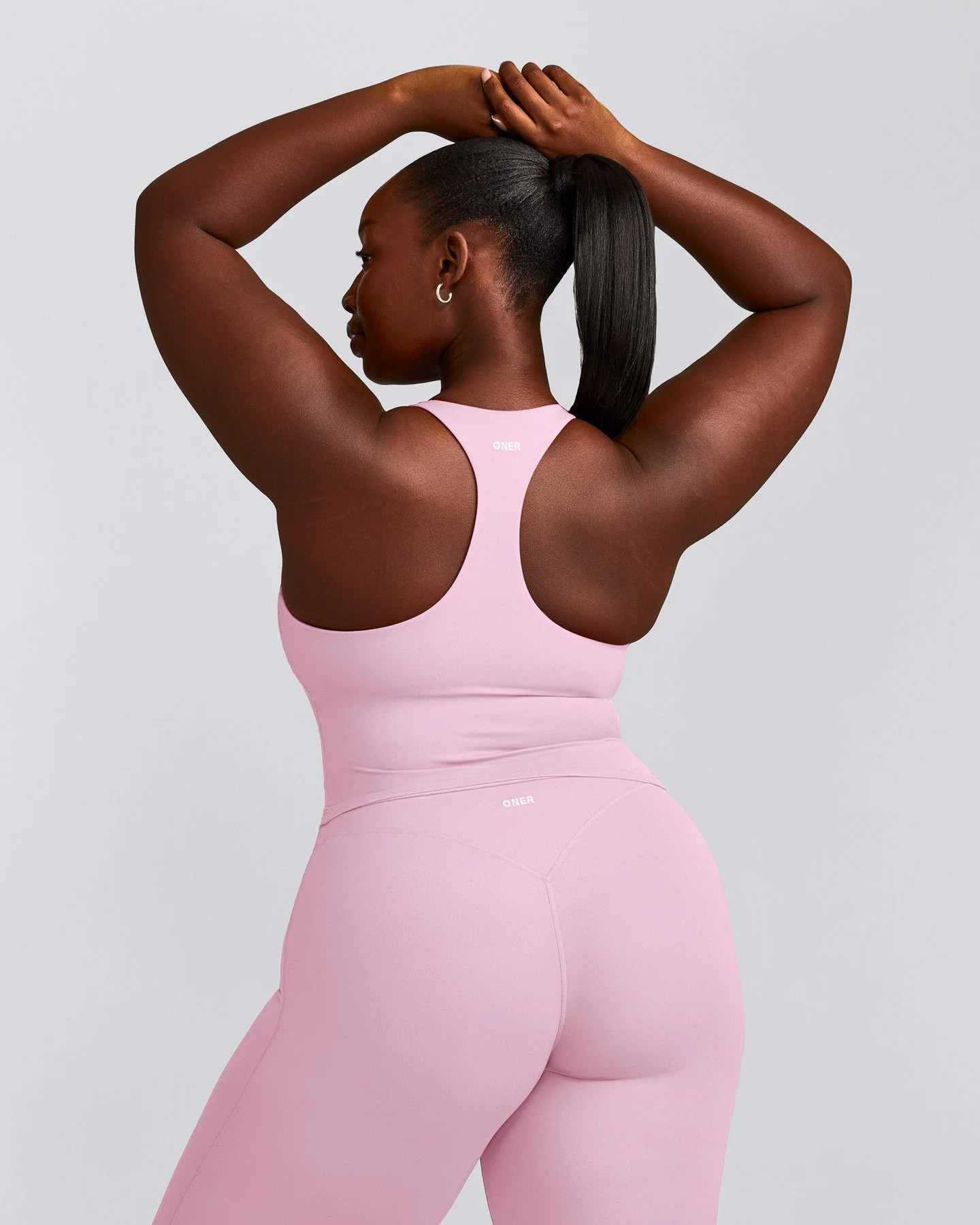 SoftMotion\u2122 Racer Back Mid Tank Top with Built in Bra Shelf with Gray Logo
Chalk Pink | Oner Active (UK / US)