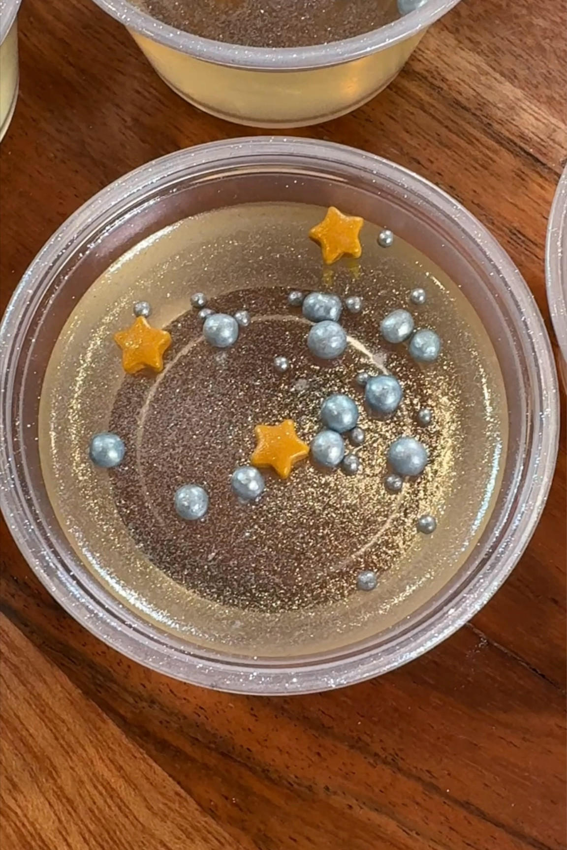 It’s NYE—let’s celebrate in style! 🥂✨ These champagne Jell-O shots are the perfect party treat to ring in the new year with sparkle and fun! 🎉 Here’s how to make them:

1️⃣ Combine 3 cups champagne, 1/2 cup sugar, and 2 tbsp fresh lemon juice. Heat on medium-low until sugar dissolves (don’t boil!).
2️⃣ Add 1 cup vodka and 4 packets (4 tbsp) of unflavored gelatin. Whisk to combine.
3️⃣ Pour into condiment containers and chill for about 3 hours.
4️⃣ Top with edible glitter and festive sprinkles before serving!

Fun, festive, and delicious—your guests will love this sweet NYE surprise! ✨ #NYEInspo #NYETreats #PartyReady #ChampagneJelloShots #CheersTo2024 #HappyNewYear

#LTKHoliday #LTKHome #LTKParties