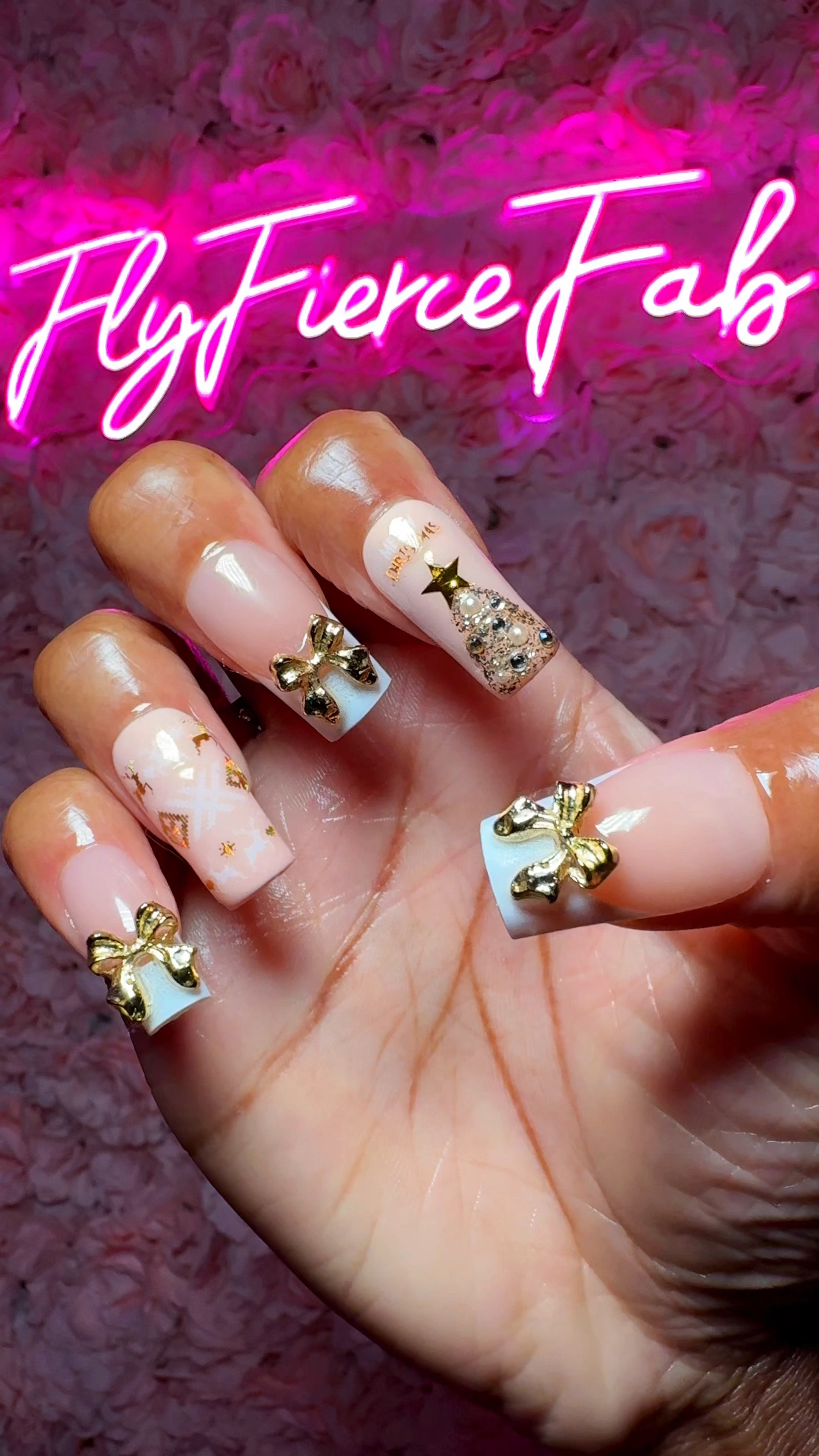 It’s time for cute Christmas nails! 🎄✨ here’s how I made this white and gold Christmas press on nail set 💅🏾.

I used long square French tip nails, and nude nails by BTArtBox which I got on Amazon 🙌🏾.

I painted the nude nails with a peachy nude gel polish by Beetles, so they would be a closer match to the base color of the French tip nails. 

Next, I applied some of these white and gold fair isle motif nail stickers that I got on SHEIN (they are available on Amazon too, but they are cheaper on SHEIN) 🦌✨.

I also painted mini Christmas trees on my nails, using gold glitter gel polish, and I applied rhinestones & pearls on top using rhinestone glue.

I used gold star nail stickers for the tree star ⭐️ , and added nail stickers that say “Merry Christmas” 🎄🎅🏾.

On the French tip nails, I applied gold bow nail charms from SHEIN 🎀✨.

To finish off the nails, I did a coat of builder gel, and a coat of topcoat. I applied to them using my favorite nail glue from Sally’s.

What should I do for my next holiday nail set? 👀🎅🏾✨

#LTKBeauty #LTKHoliday #LTKWatchNow