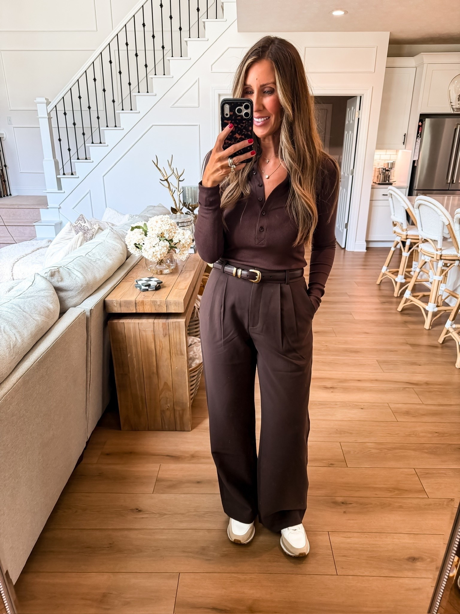 This monochromatic chocolate brown outfit is such a chic way to do casual fall style. The ribbed henley adds just the right amount of texture, the tailored trousers create a flattering silhouette, and the sneakers keep it comfortable for everyday wear.

brown monochrome outfit, ribbed henley top, wide leg trousers, casual workwear, fall outfit ideas, elevated basics, everyday style, neutral wardrobe, comfortable fashion, TheMomInStyle

#LTKWorkwear #LTKTravel #LTKdayinmylife