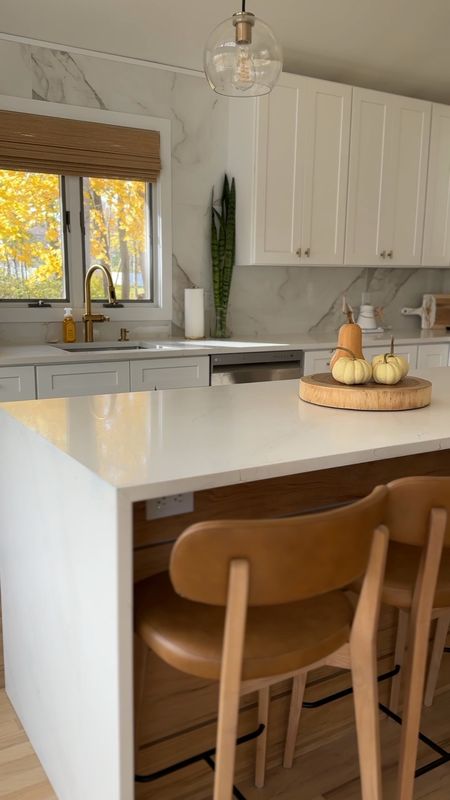White and wood kitchen renovation. Mid-century modern, clean aesthetic. 

Planter
Counter stools
Shelf styling
Bamboo blinds
Faucet
Gold hardware

#LTKVideo #LTKhome #LTKfindsunder100