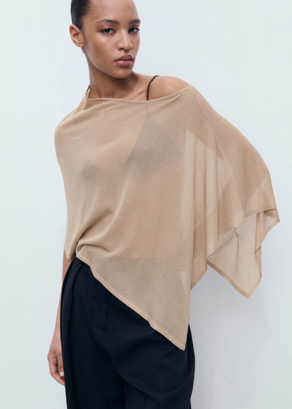 Asymmetrical knitted cape - Women | MANGO United Kingdom | MANGO (UK)