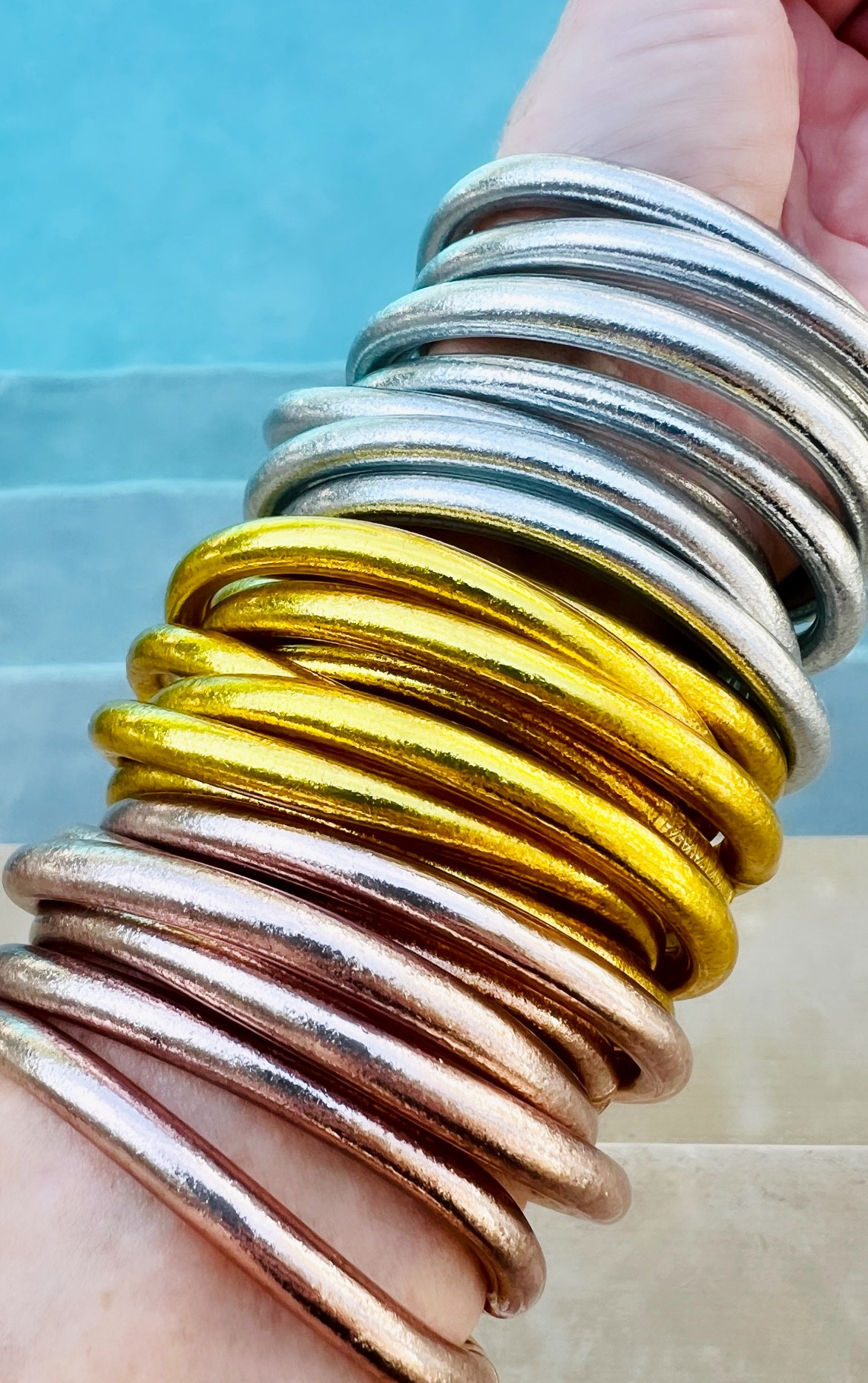 #ad is there such a thing as wrist candy? 🍭 If so, these bangles are the sweetest thing to ever happen to your arm💗 Introducing @budhagirl all weather bangles.  The absolute prettiest travel and vacation accessory. These bangles are weightless, soundless, waterproof and TSA approved.  Take them to the beach, the pool or even the mountains without bothering a soul on the plane ✈️   These lifestyle bangles come in many different colors so no matter the occasion, #budhagirl has you covered 👊🏼 

#LTKswim #LTKtravel #LTKstyletip