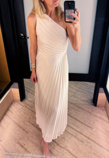 Stunning pleated one shoulder white dress from Abercrombie. Great for a wedding guest dress - comes in several colors! Runs tts. Gretchen wearing a small. 

#LTKOver40 #LTKSeasonal #LTKParties