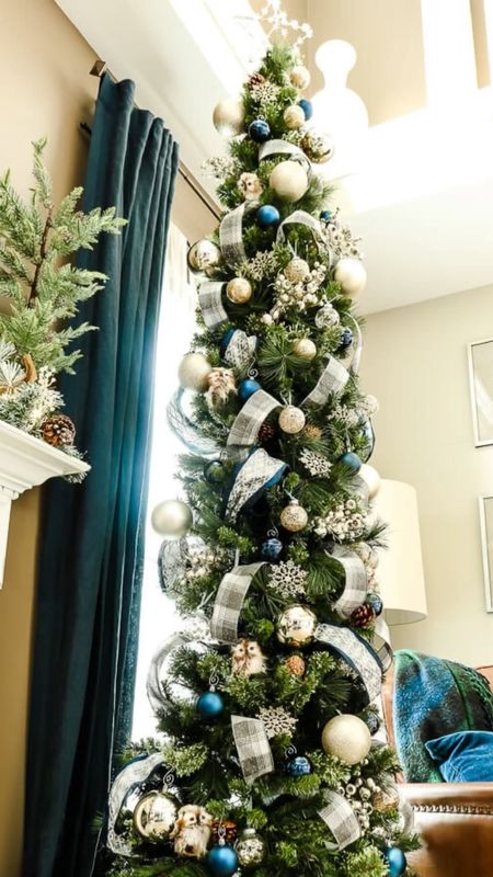 Decorate my skinny Christmas tree with ribbon in gold, silver, navy, and green