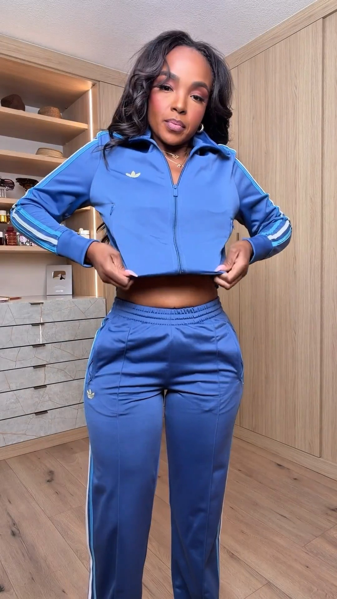 Hi Babes!

This outfit is giving sporty chic in the best way 💙🖤✨

I love how the silky scarf-inspired top softens the look while the oversized track pants and bucket hat add that cool-girl edge. It's the perfect mix of comfortable, trendy, and effortlessly stylish.

Where to wear this:
• Airport travel days
• Weekend errands
• Casual brunches
• City sightseeing
• Concerts
• Shopping days

Style tip: Match your shoes or accessories to one of the colors in the top to make the whole outfit feel intentional and elevated.

Undergarments: Seamless nude bra and seamless underwear.

Everything is linked below

xx Kira | IG: KirasFashionFinds

34D - 27 - 40 • Size Small or 4