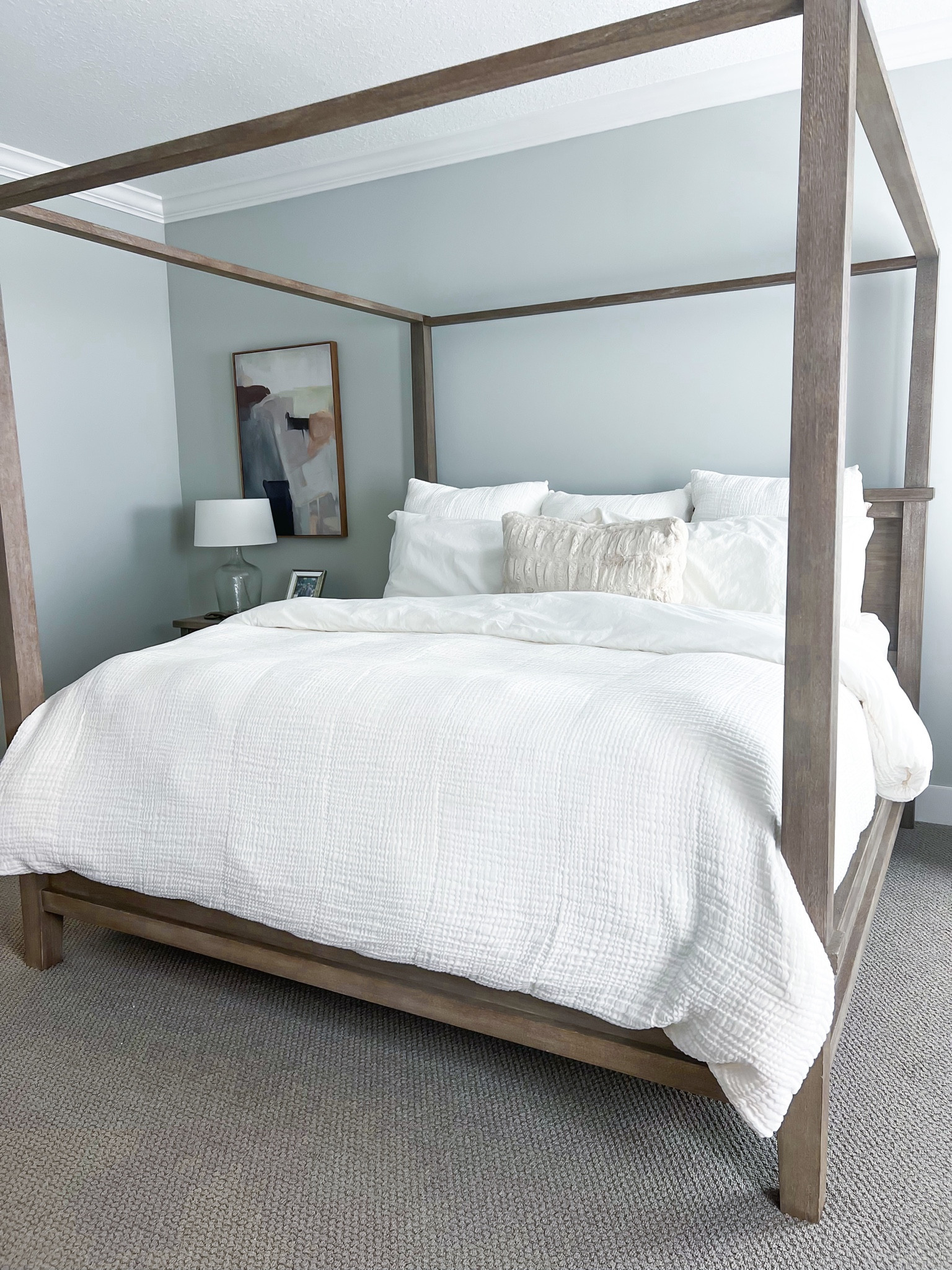 Bedroom inspo. Pottery Barn canopy bed (king, gray wash). Pottery barn bedding. White bedding. Coastal home. Pottery Barn cloud duvet. Pottery barn duvet insert (light). Also linking our dresser and nightstand - we switched out the knobs on night stand to match the dresser! Both are gray wash color. Target lamps. 

#LTKsalealert #LTKfamily #LTKhome