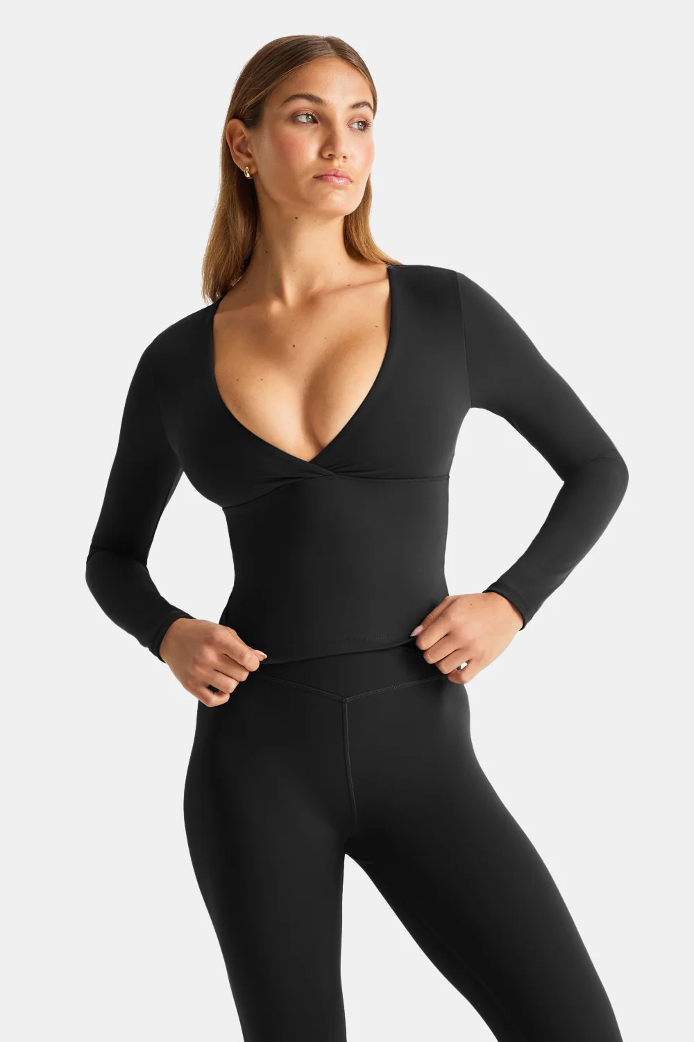 Elissa / UK 8 / Tala Size XS / Height 5’9






 
DayFlex V Neck Top - Shadow Black
£48.00
Size guide
4.2 out of 5 star rating
See reviews summary
Select your Size
Select Size
2XSNotify me when back in stock
XS
S
M
L
XLLow in Stock
2XLNotify me when back in stock
3XLNotify me when back in stock
4XLNotify me when back in stock
Select your Size
made with recycled fibres / built-in support / buttery soft
Like our viral boob-job vest but with long-sleeves.
/ Wear it with

available in 4 lengths
DayFlex Wrap Flared Yoga Pant No Front Seam - Shadow Black
£64.00
+add



thumb holes
DayFlex Zip Through Sports Jacket - Shadow Black
£69.00
+add



available in 4 lengths
DayFlex Wrap Flared Yoga Pant - Shadow Black
£64.00
+add


available in 4 lengths
DayFlex High Waisted Flared Yoga Pant No Front Seam - Shadow Black
£64.00
+add


Low in Stock
DayFlex Wrap No Front Seam Legging - Shadow Black
£59.00
+add



light support
DayFlex Twist Front Sports Bra - Shadow Black
£42.00
+add



back in stock!
Cocoon Zip Through Hoodie - Black
£59.00
+add



Sold Out
TALA Active Applique Hoodie - Americano
£62.00
£31.00


Sold Out
Essential Padded Tote Bag - Black
£59.00


Sold Out
TALA Crew Socks 2 Pack - White
£15.00

Wear
Care
Aware
/ Wrap front, v neckline

/ Double layered DayFlex airbrushed fabric

/ Full length

/ Embroidered logo centre back

/ Internal bra shelf with removable bra pads

/ Long sleeves

/ Consciously created with sustainability in mind, made from 75% Recycled Polyamide and 25% Elastane
Model Info:
Elissa / UK 8 / Tala Size XS / Height 5’9
Select your Size
 | TALA (UK)
