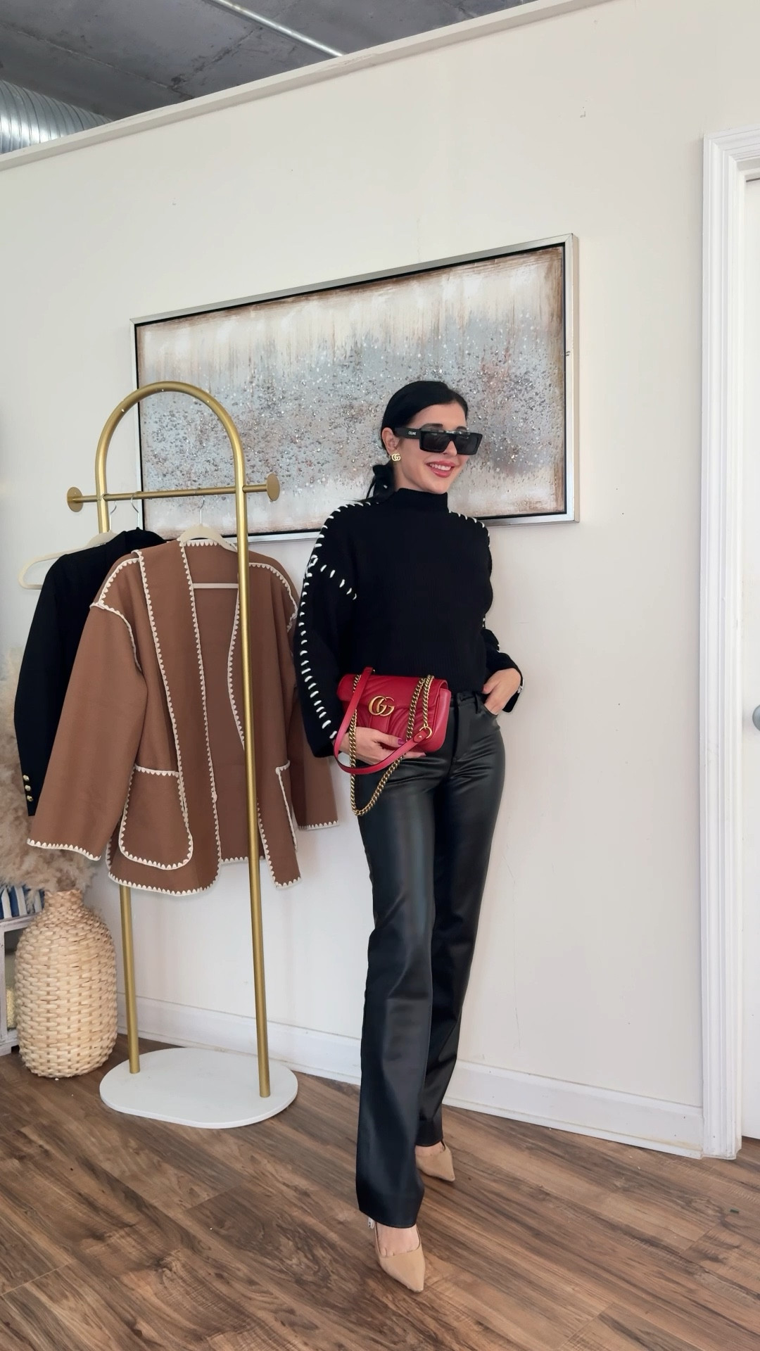 Black outfit for work or date night 🖤 pairing leather pants with contrast stitch sweater and teddy shirt coat with a pop of red 🫶🏻 

#LTKstyletip #LTKVideo #LTKworkwear