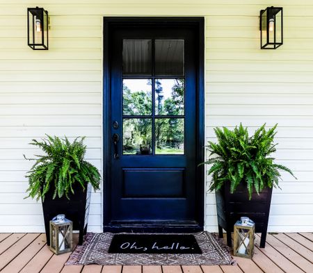 Front door refresh for spring and summer: front porch, doormat, lanterns, planter boxes, artificial ferns 

#LTKhome #LTKstyletip #LTKSeasonal