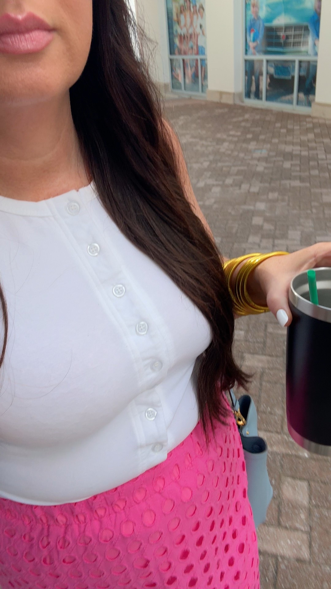 Pink eyelet skirt and white buttoned vest top 

#LTKWorkwear #LTKOver40 #LTKTravel