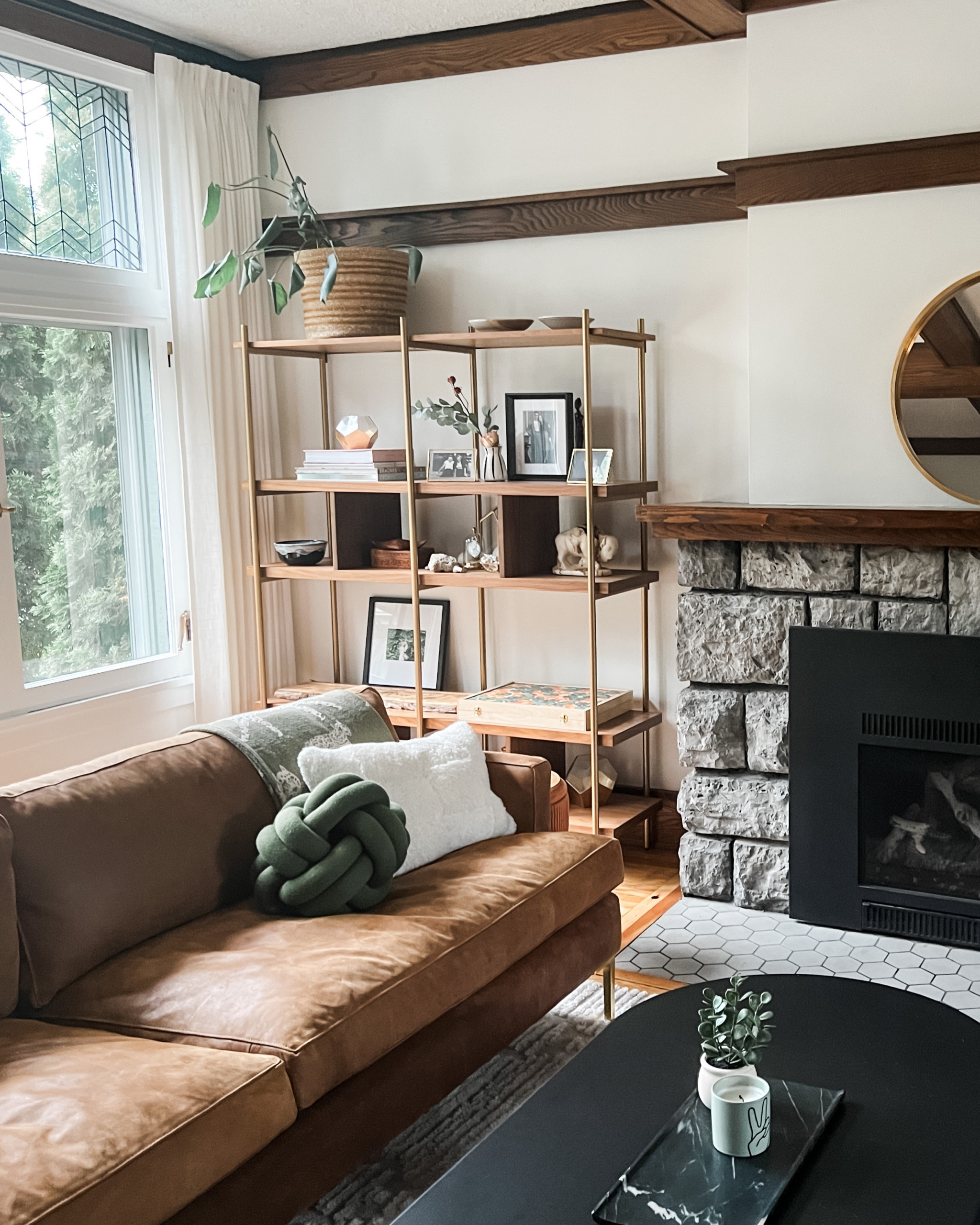 After 2 years of renovation, so happy to call this place home! Sharing a first glimpse of our living room where we kept all the original details, adding modern touches throughout with art and furniture. 

This custom leather sofa by Anthropologie was one of the first pieces we bought. It’s timeless and adds warmth to the space with its rich patina color and brass legs.

#LTKhome #LTKstyletip #LTKFind