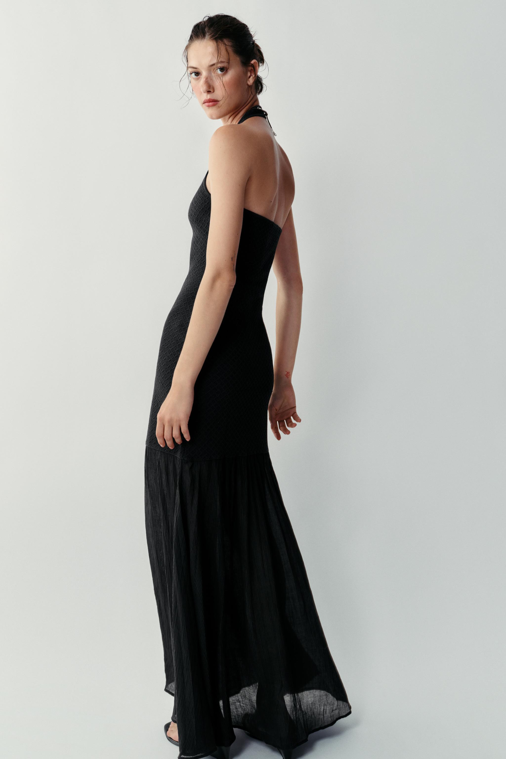 Long halter neck dress with round neckline and open back. Combination fabric with flowy hem. | Zara US